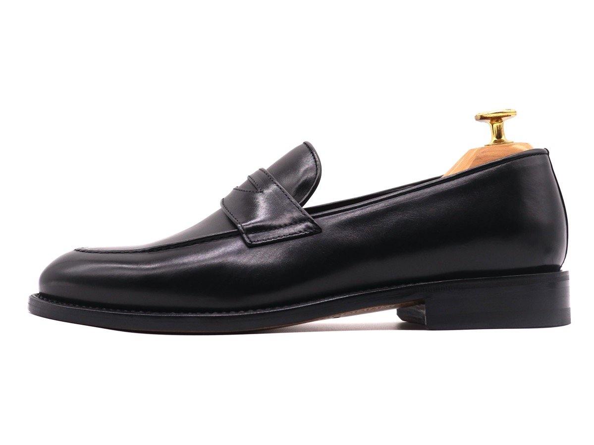 Side_View_of_Dejon_Black_Leather_Penny_Loafers